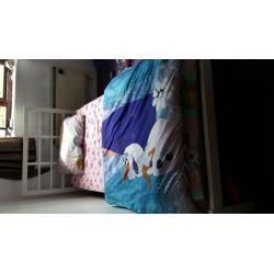 Single bed with mattress and mattress protector