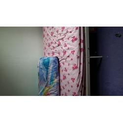 Single bed with mattress and mattress protector