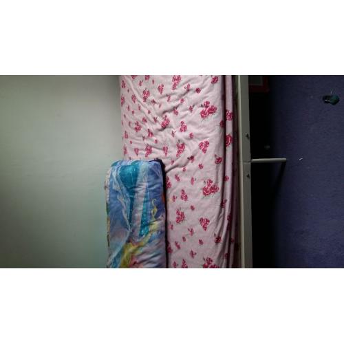 Single bed with mattress and mattress protector