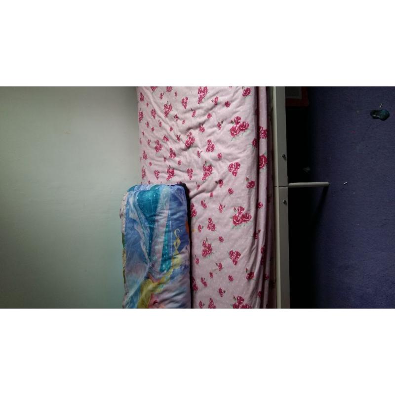 Single bed with mattress and mattress protector