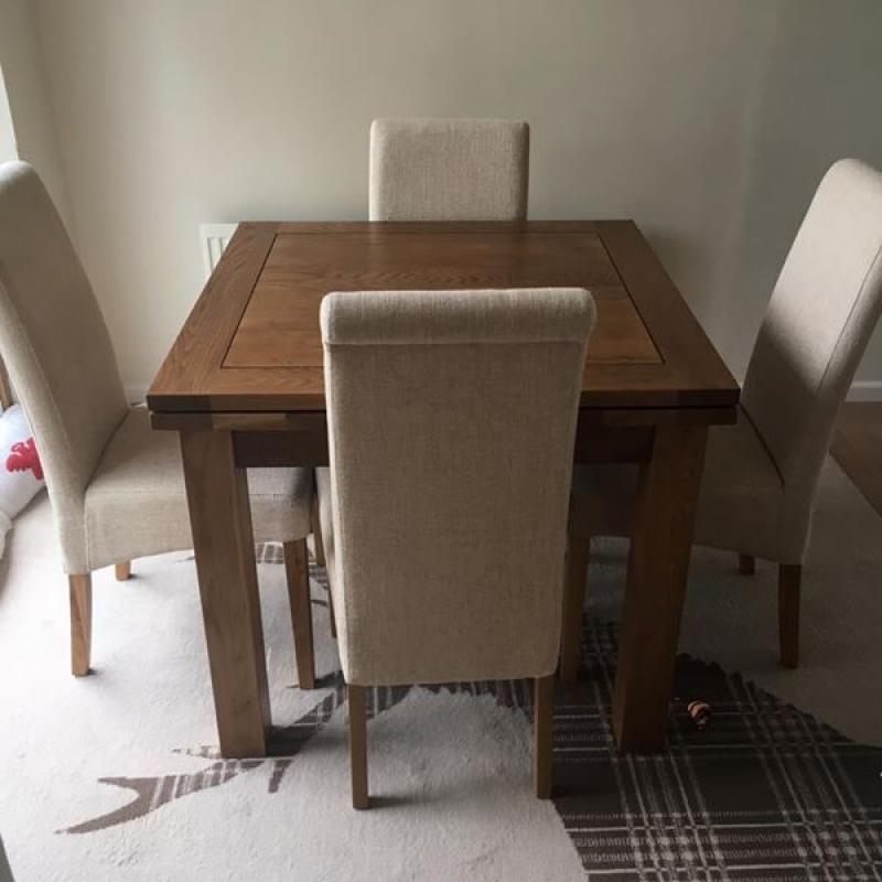 Solid oak extending dining table and chairs