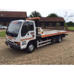 Izuzu NPR tilt and slide recovery truck
