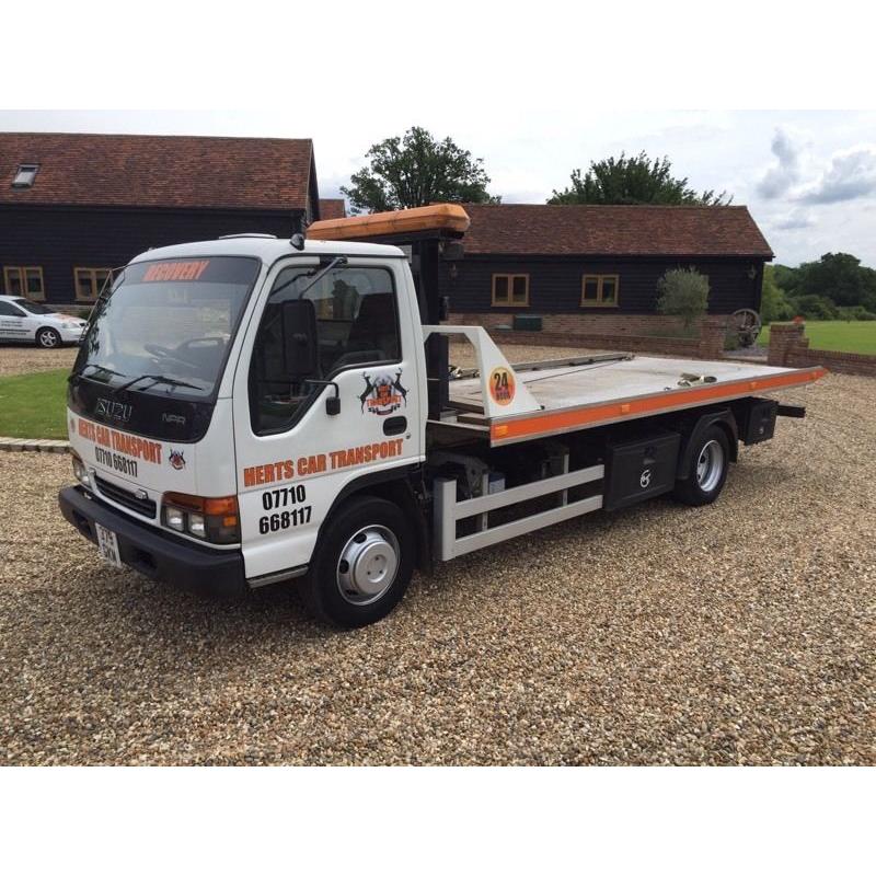 Izuzu NPR tilt and slide recovery truck