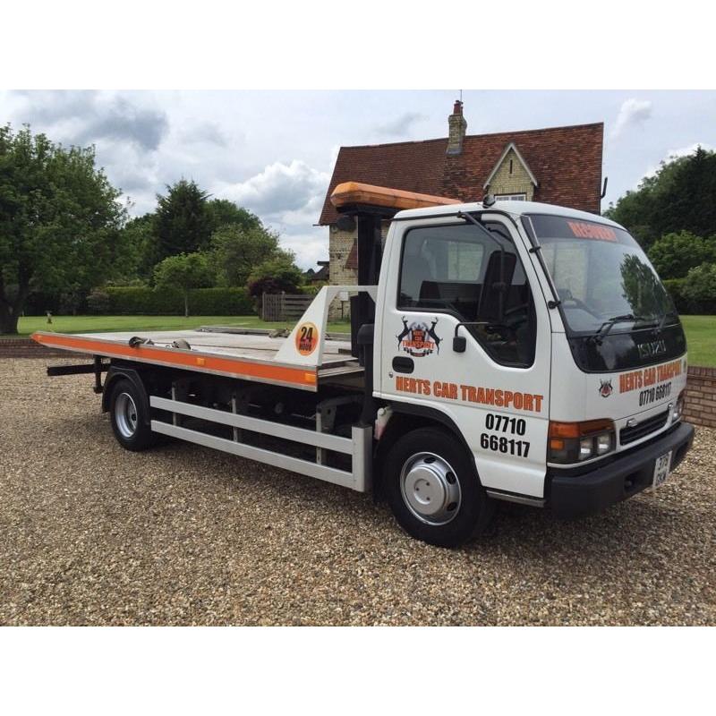 Izuzu NPR tilt and slide recovery truck