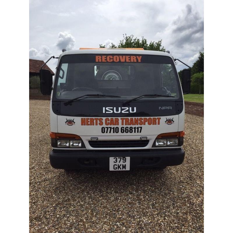 Izuzu NPR tilt and slide recovery truck