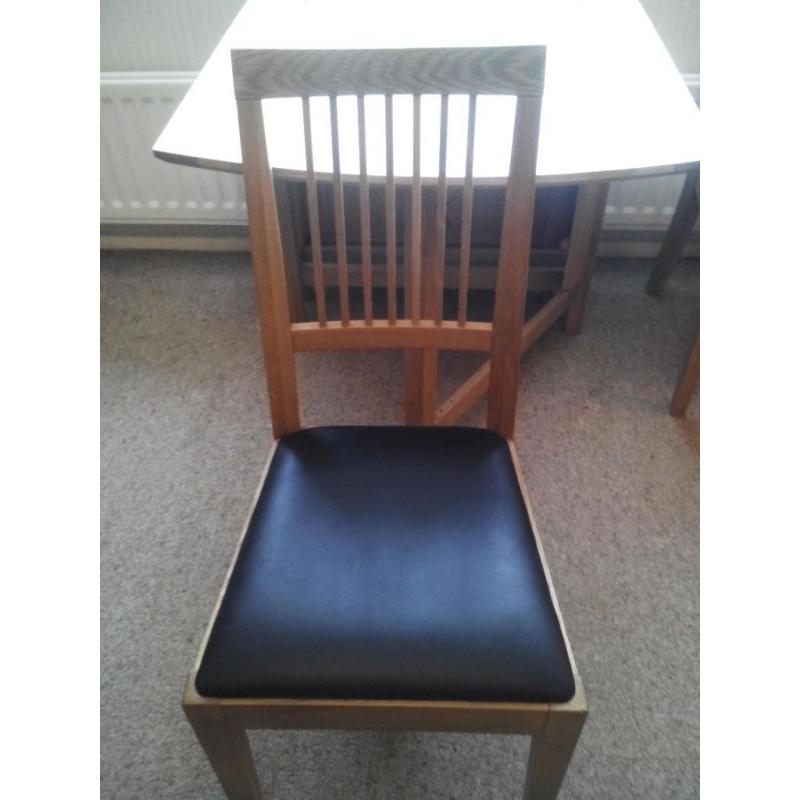 Oak Dining table and two chairs
