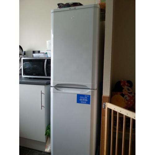 Tall Indesit fridge-freezer.