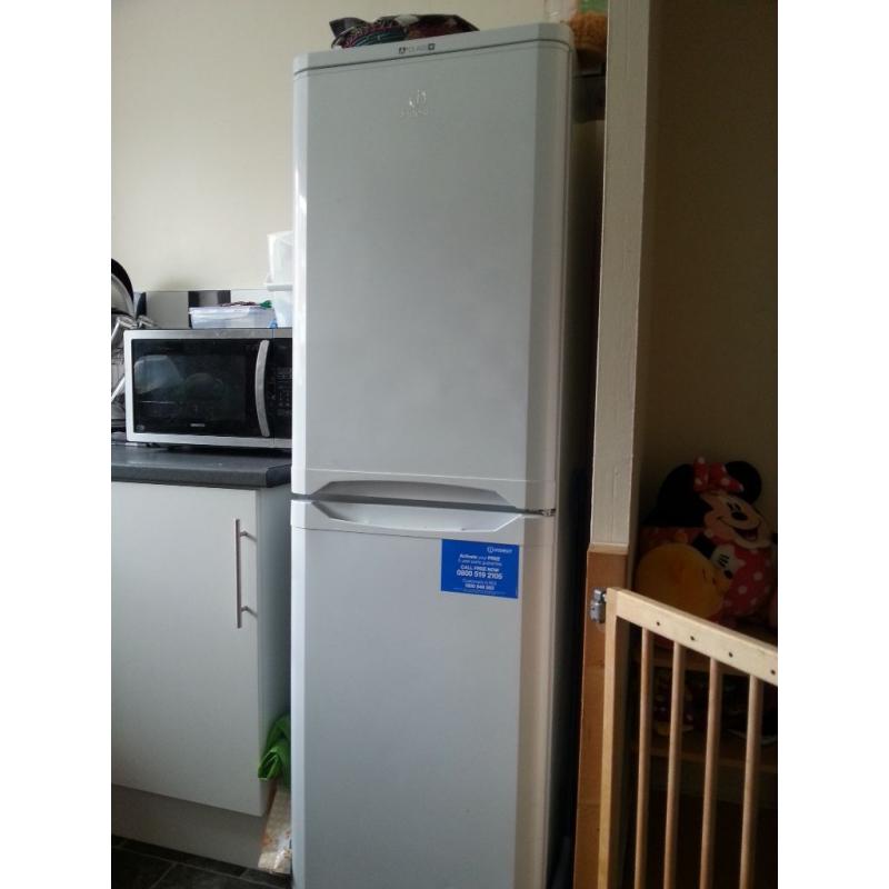 Tall Indesit fridge-freezer.