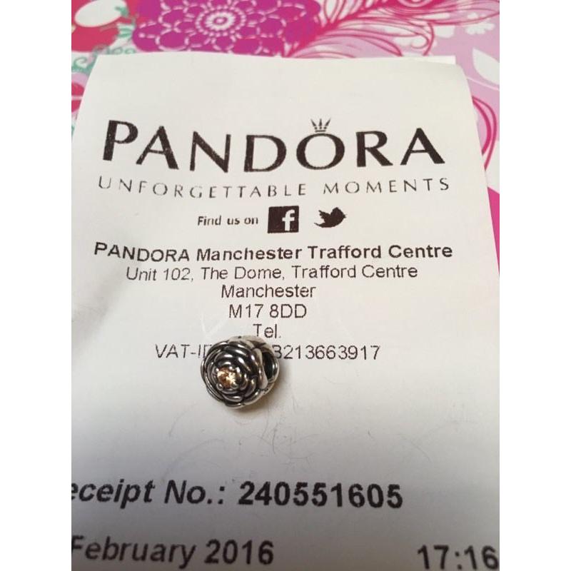 Pandora rose charm with rose gold CZ stone in the middle