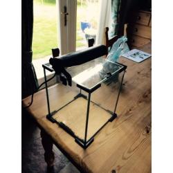 Aquel small tropical fish tank with lamp and black gravel