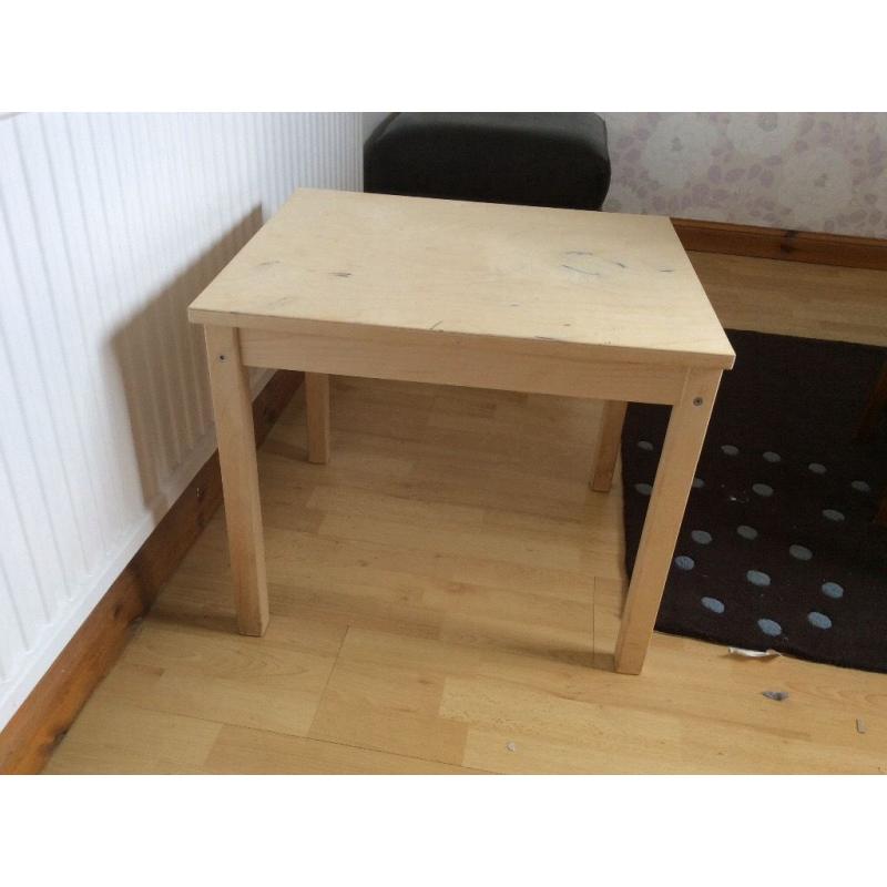 IKEA child's table,blue pictures,small brown picture,teal canvas, vase and contents