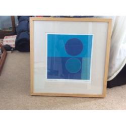 IKEA child's table,blue pictures,small brown picture,teal canvas, vase and contents
