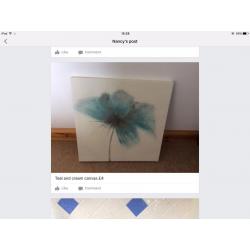 IKEA child's table,blue pictures,small brown picture,teal canvas, vase and contents