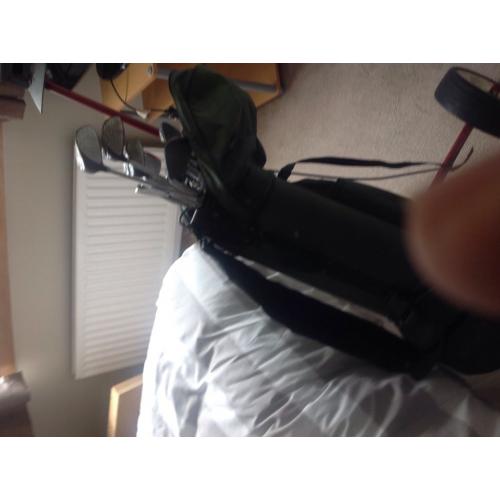 Golf clubs and trolley