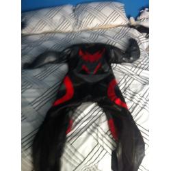 Size 44 Buffalo one piece leather suit, red and black. Leathers.