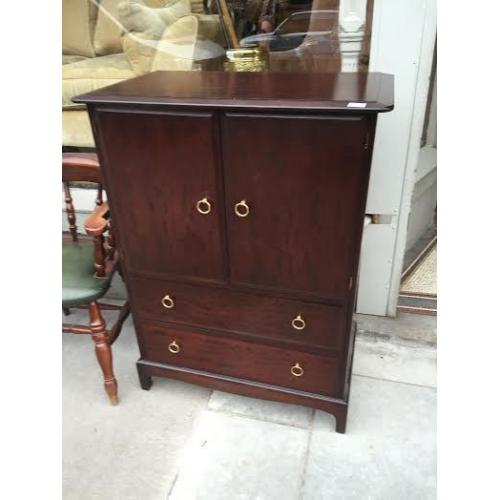 Stag Cabinet - has drawers and cupboard space. Size W 32in D 18in H 44in. Free local delivery.