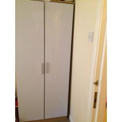 High gloss white wardrobe an bedside table