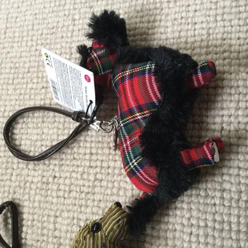 Two Fuzzynation dog shaped purses