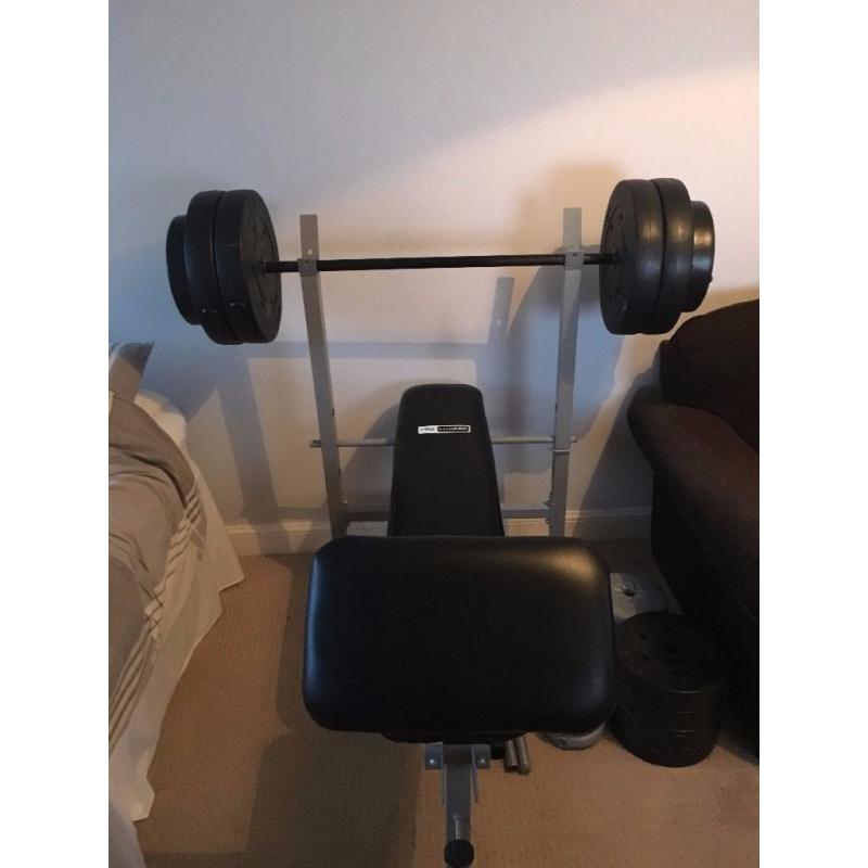 Weights bench + 85Kg of weights and bars