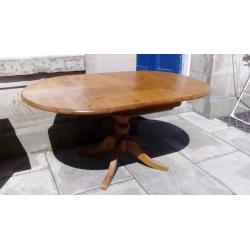 Pine drop leaf dining table with pedestal leg .