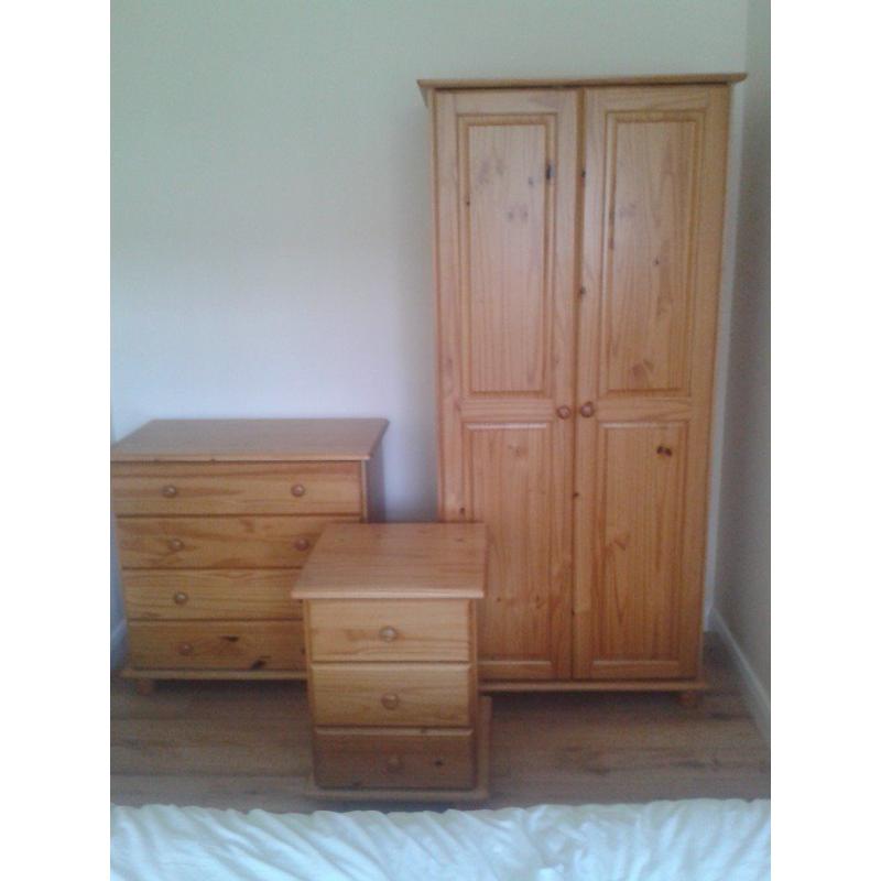 Three piece solid pine bedroom suite-wardrobe, chest of drawers, bedside cabinet.Excellent condition