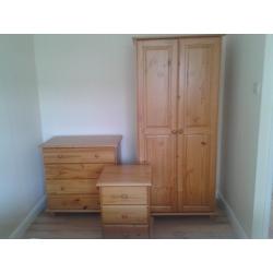 Three piece solid pine bedroom suite-wardrobe, chest of drawers, bedside cabinet.Excellent condition