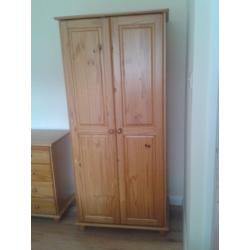 Three piece solid pine bedroom suite-wardrobe, chest of drawers, bedside cabinet.Excellent condition