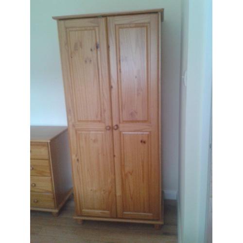 Three piece solid pine bedroom suite-wardrobe, chest of drawers, bedside cabinet.Excellent condition