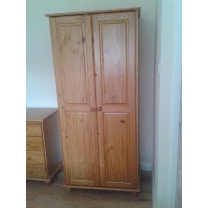 Three piece solid pine bedroom suite-wardrobe, chest of drawers, bedside cabinet.Excellent condition