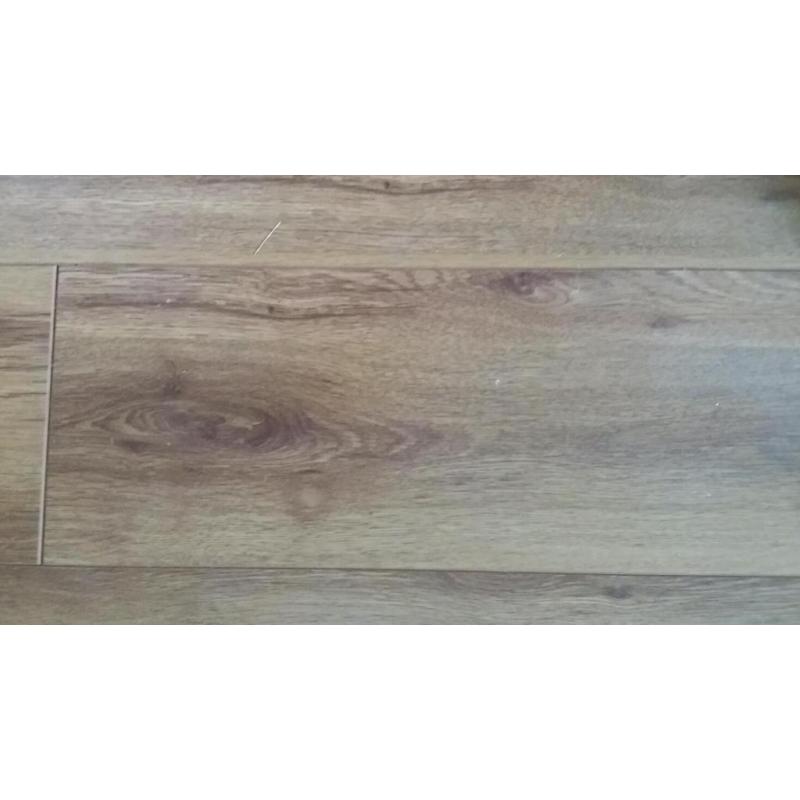 Laminate flooring Oak effect finish.