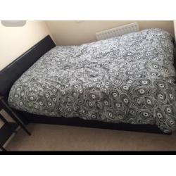 Black side lifted double bed