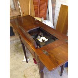 Original Singer sewing machine in the original table