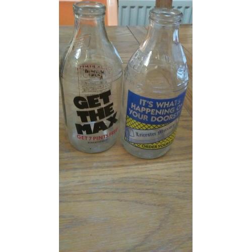 2 decretive milk bottles