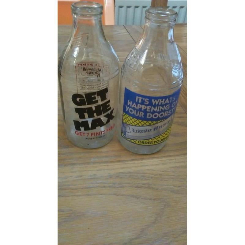 2 decretive milk bottles