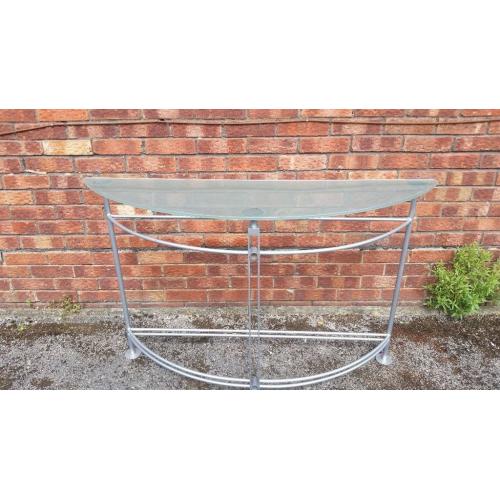 Smoked glass and chrome occasional table. Can be used in hall or lounge. Very stylish, from Heals.