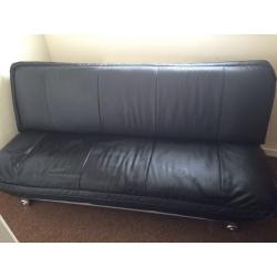 Leather look sofa bed.