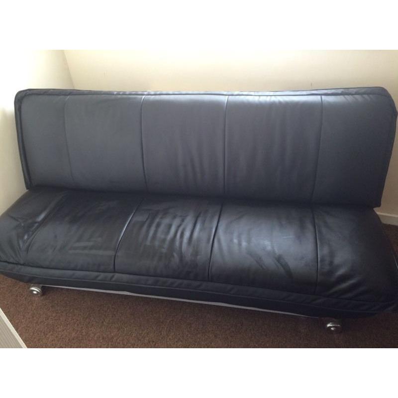 Leather look sofa bed.