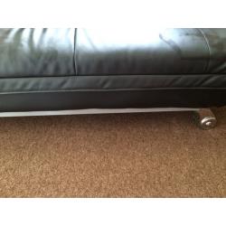 Leather look sofa bed.