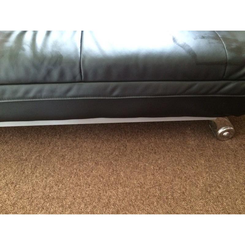 Leather look sofa bed.