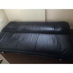 Leather look sofa bed.