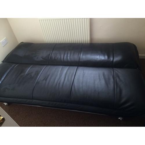 Leather look sofa bed.