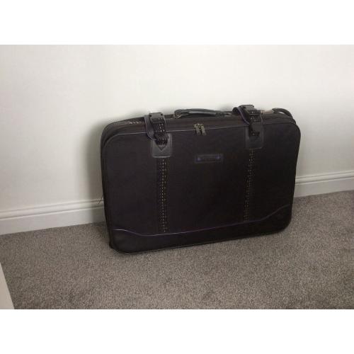 Black suitcase with wheels, 71cm wide x 46cm high