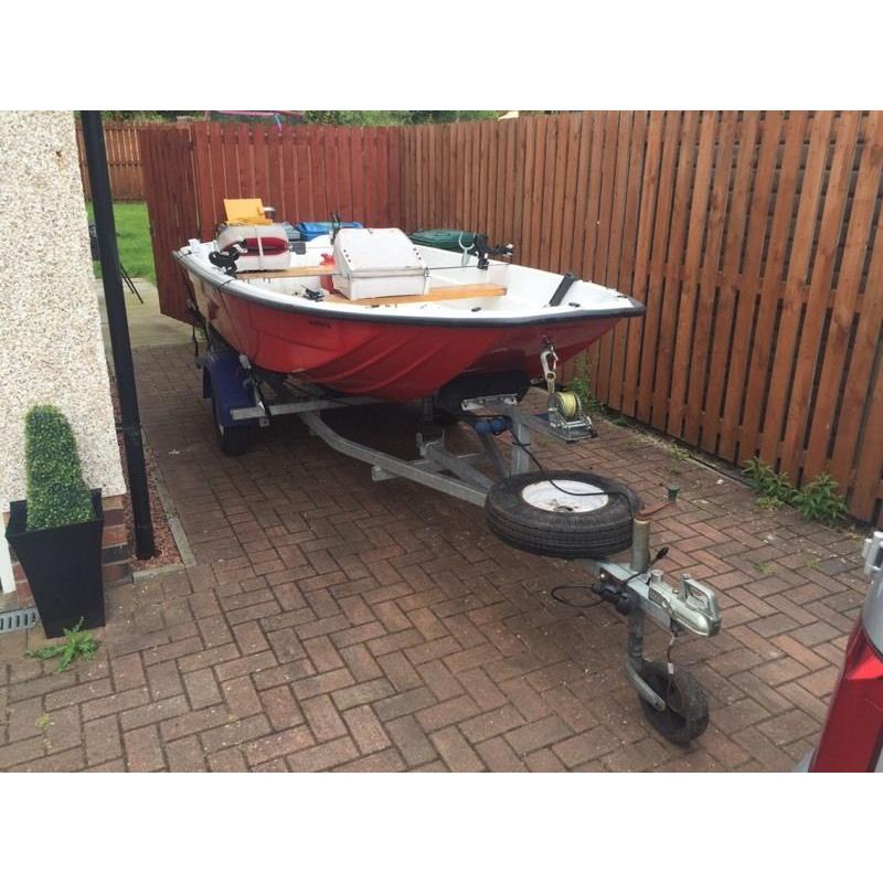 13ft dory with trailer and 9.9 evinrude 2 stroke engine