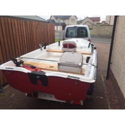 13ft dory with trailer and 9.9 evinrude 2 stroke engine