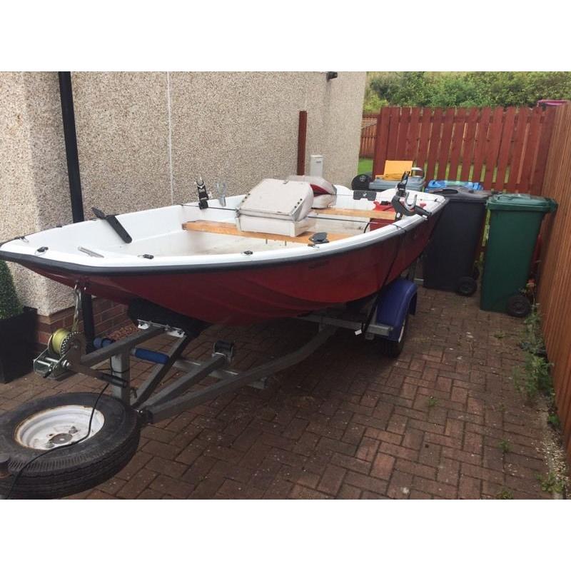 13ft dory with trailer and 9.9 evinrude 2 stroke engine