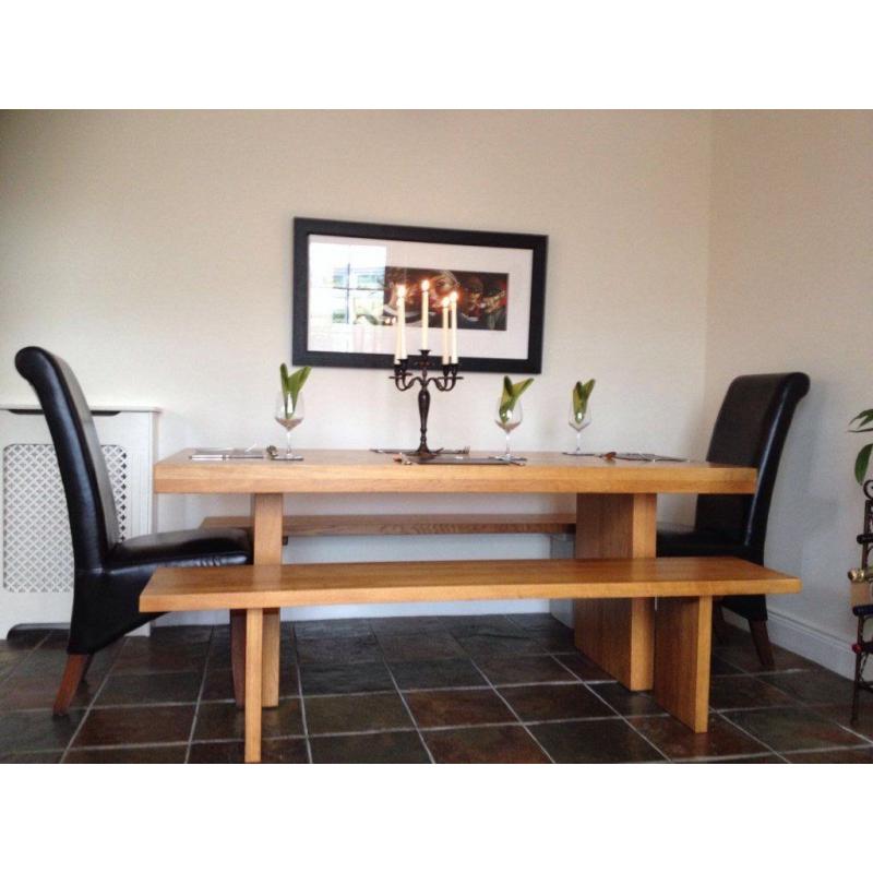 Beautiful solid oak refectory dining table, benches and chairs. Seats 8.
