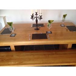 Beautiful solid oak refectory dining table, benches and chairs. Seats 8.