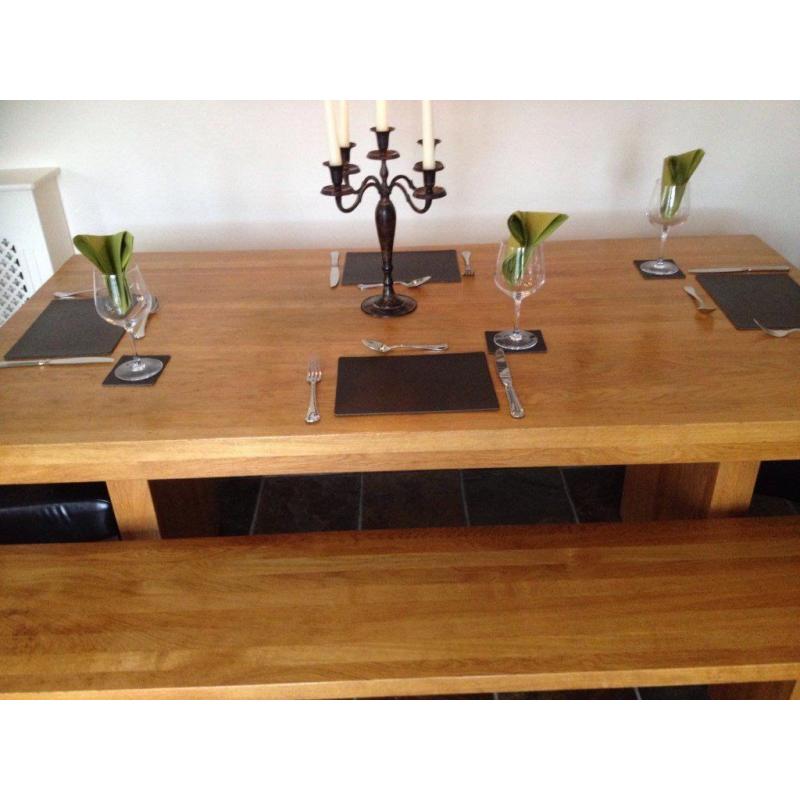 Beautiful solid oak refectory dining table, benches and chairs. Seats 8.