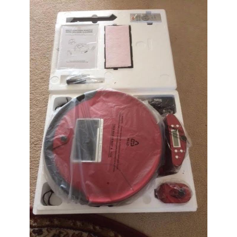 Red Robot vacuum cleaner with remote control