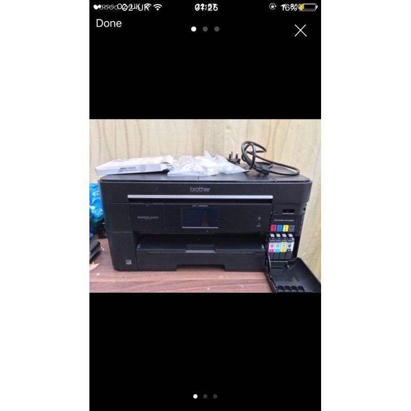 Brother MCF-J625DW A3 printer, with ink cartridges, connectors and more.